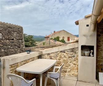 Charming and renovated village house with 2 bedrooms, cellar and terrace. Lots of character !