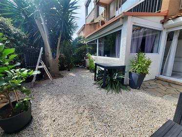 Ground floor apartment with small garden in a private residence, just 400 m from the beach.
