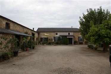 Renovated character house on one level with outbuildings on 1.4 ha of land.