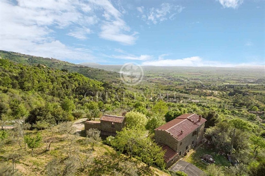 This charming stone farmhouse, with typical Tuscan finishes, is located in the hills surro