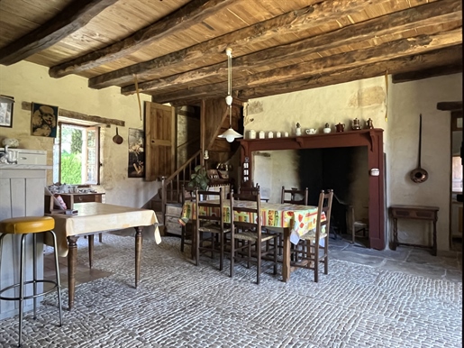 In the Périgord Noir, characteristic house with outbuildings around a ...