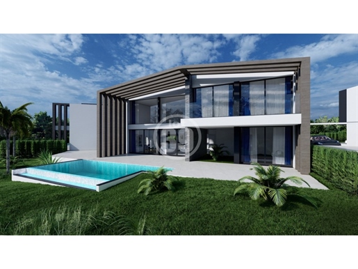Plot of land sold with approved project for 3 magnificent villas with individual pool.