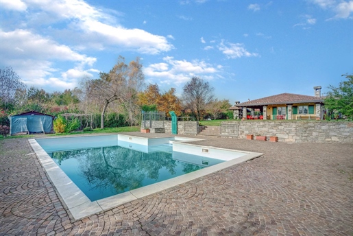 Villa with swimming pool and garden surrounded by nature