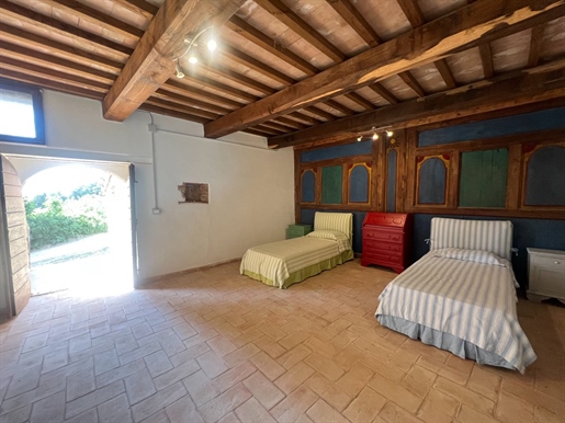 Portion of a renovated farmhouse on two levels with garden and external loggia, for sale i