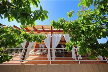 A house for sale with seven apartments in Sukošan. The house...