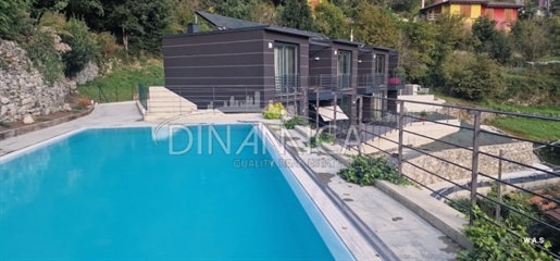 Prestigious apartments in a luxury terraced complex with pool and views of Lake Como.

T