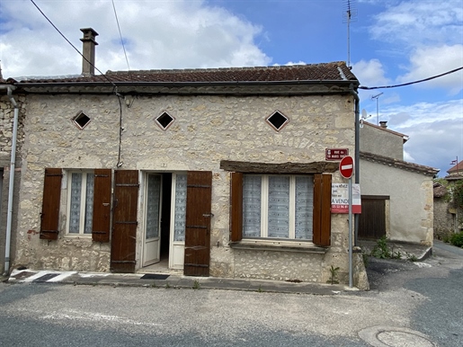 In the village, close to all services and shops, stone house with adjoining barn composed of a living room, a kitchen, a bedroom, a bathroom with toilet. P...