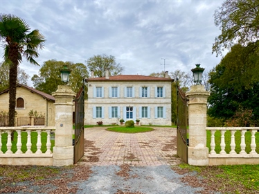 This magnificent 19th century maison de maître on the banks of the Dordogne, surrounded by its park