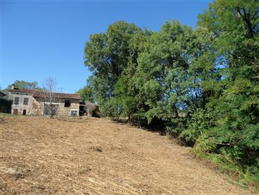 Pretty stone house in quiet hamlet, attached outbuildings to renovate, on 5500m2 of land