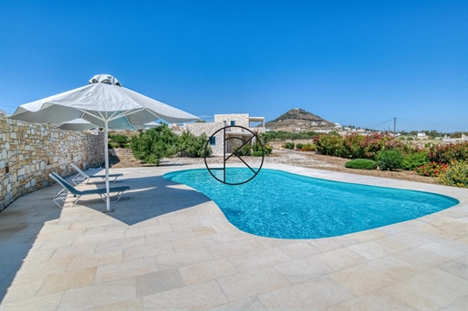 Stone house with sea view, swimming pool, roof terrace and Naxos marble.
